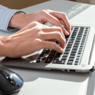 Effective writing in the workplace training showing professional writing at a desk